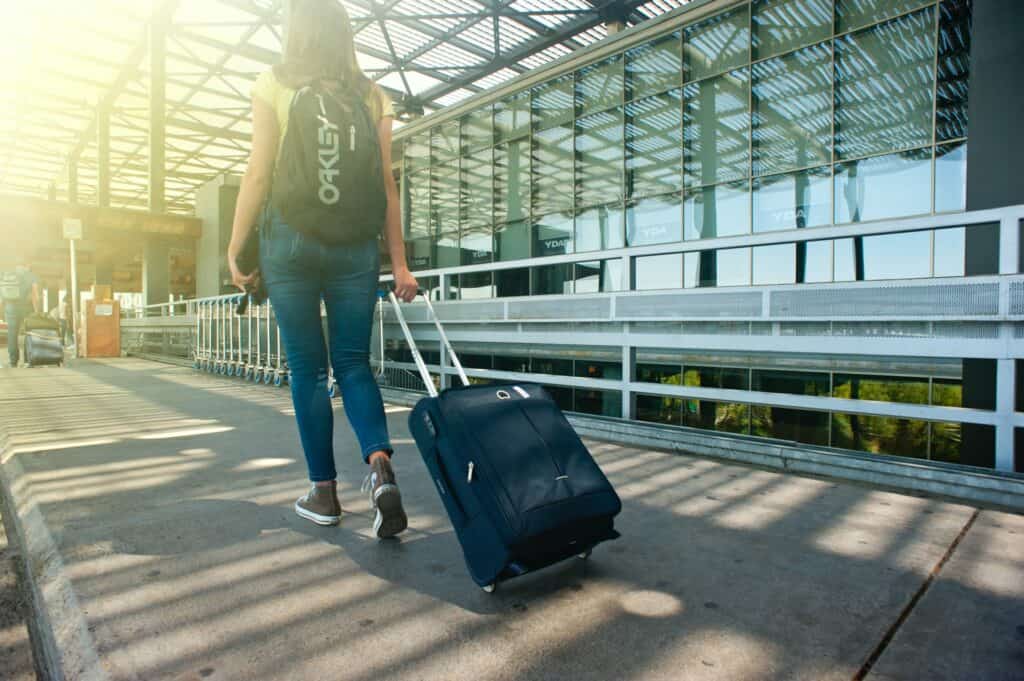 girl with luggage at the airport