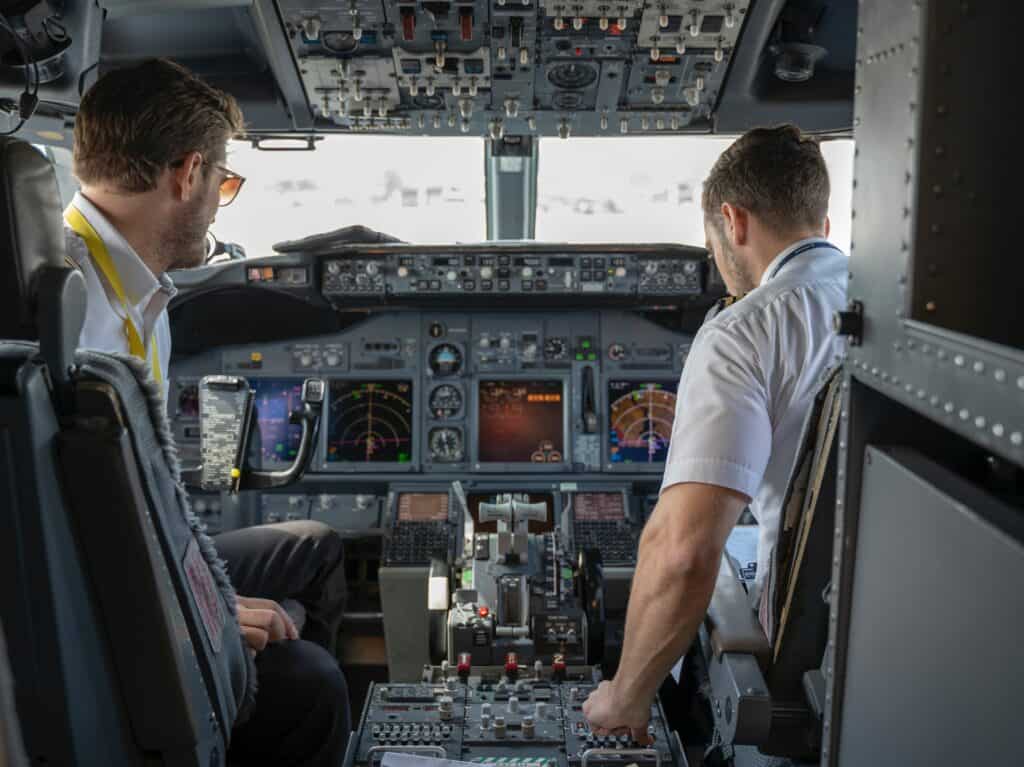 pilots in aircraft cabin