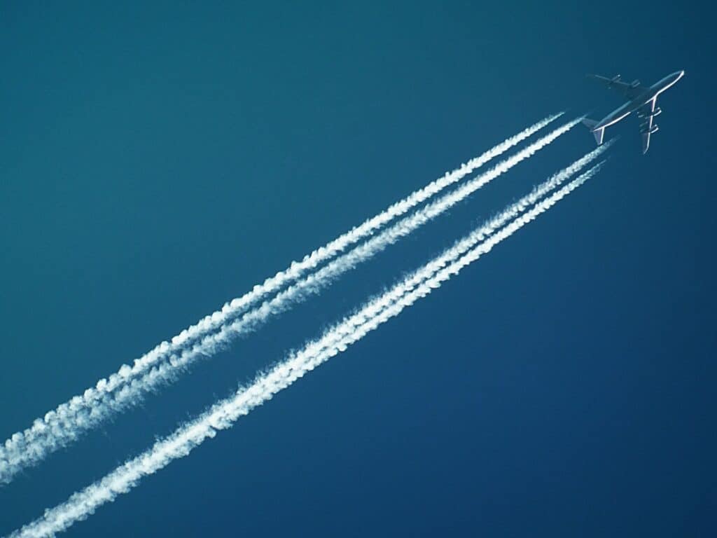 Airplane leaving traces in the sky