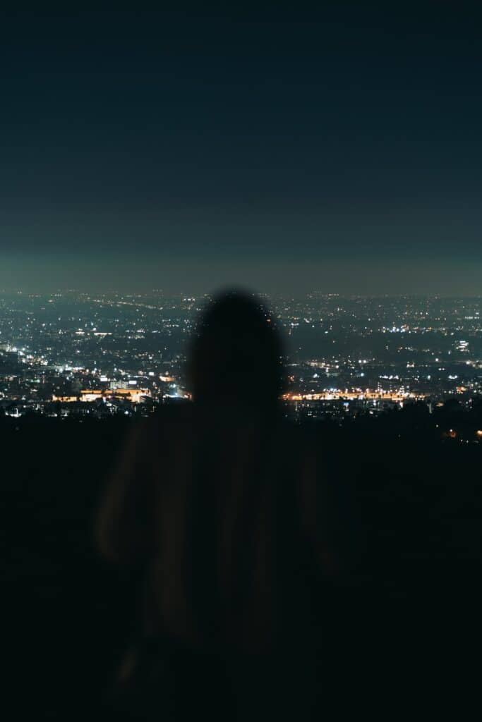 person looking at los angeles by night